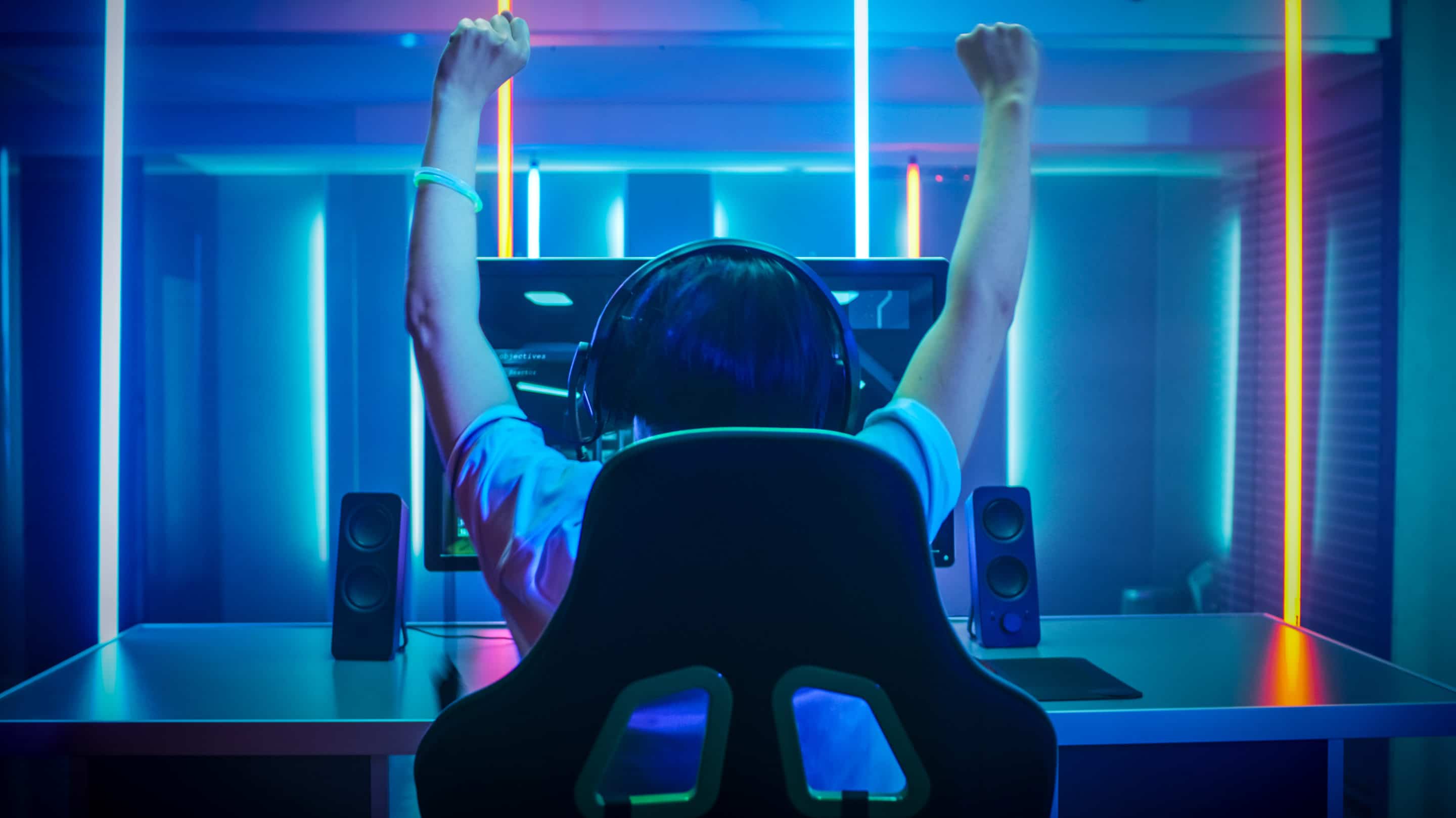 Gamer celebrating win while using gaming VPN